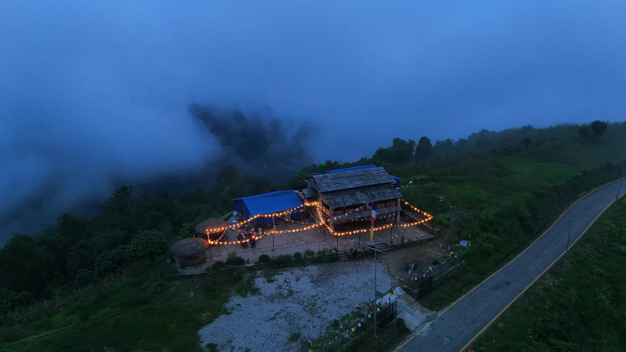 Lit up under the twilight sky—where warm lights meet the mountain breeze.