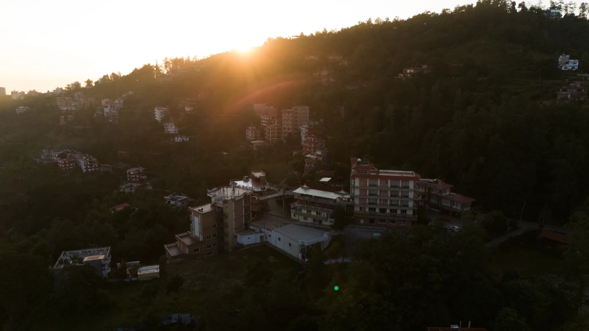 Golden rays painting the hills—wake up to magical sunrises above the misty valleys.